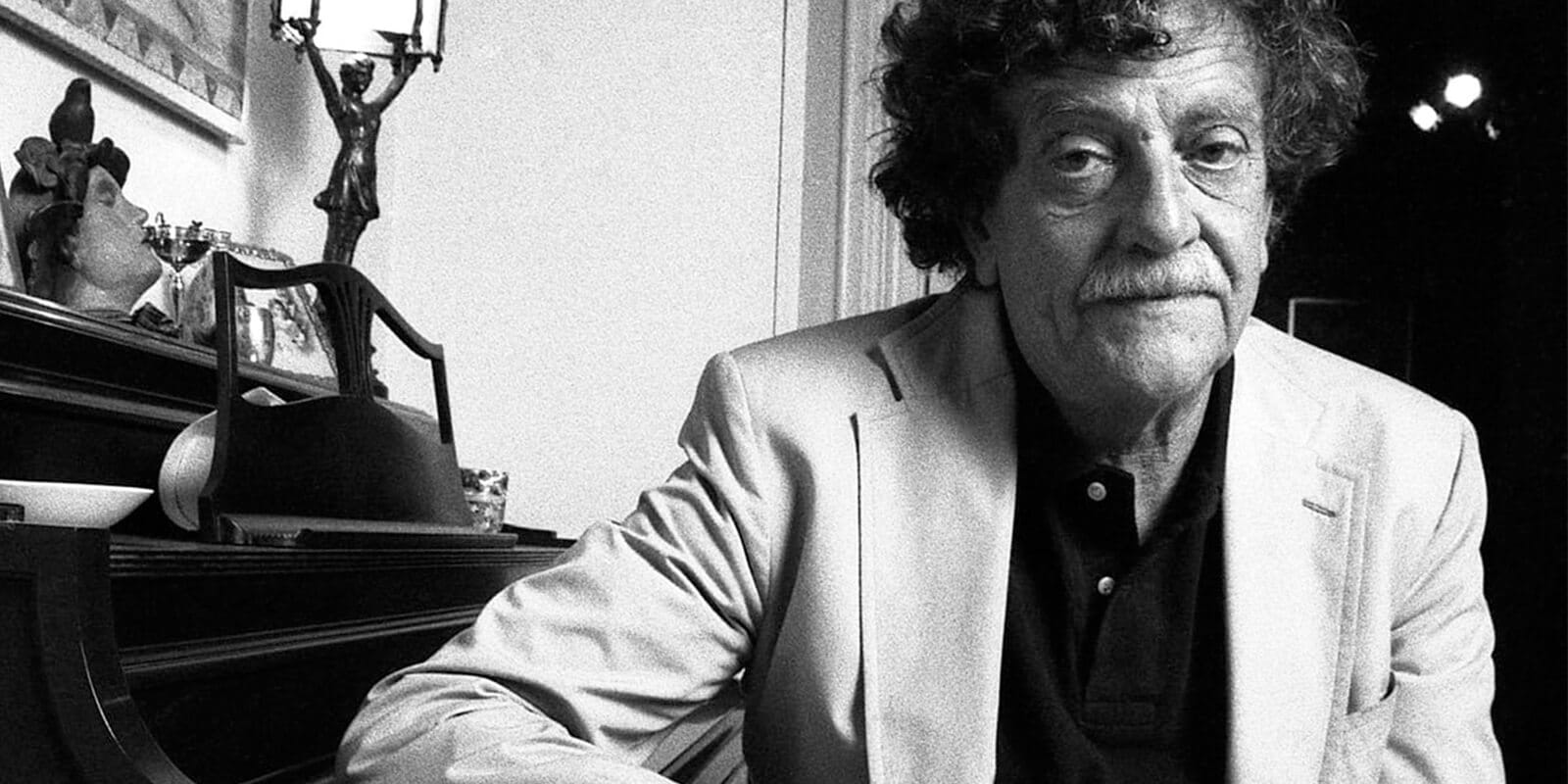 Kurt Vonnegut seated in his study